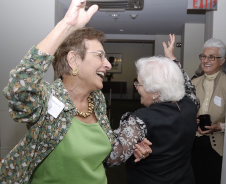 Women dancing & laughing - Photo by Mimi Katz